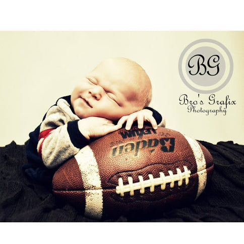 child laying on foorball portrait on white background