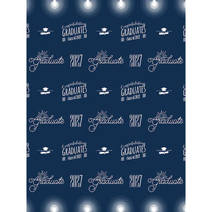 Navy blue graduation backdrop with repeating white Graduate and Class of 2027 lettering, graduation cap and diploma graphics, congratulatory text, decorative bursts, and glowing lights along the top and bottom.