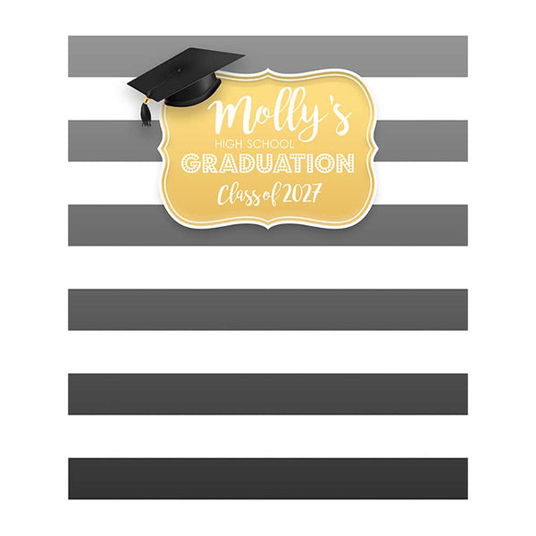 Graduation backdrop with wide gray and white horizontal stripes, a gold decorative plaque reading Molly's High School Graduation Class of 2027, and a black graduation cap with tassel.
